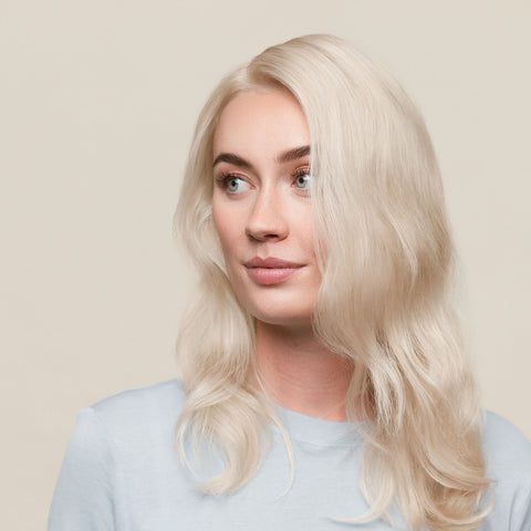 extreme ash blonde hair color result on a person